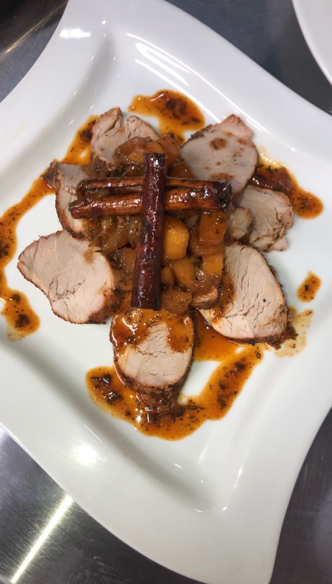 Pork tenderloin plated with a pan reduction, the lean cut that needs fast high heat rather than a long roast