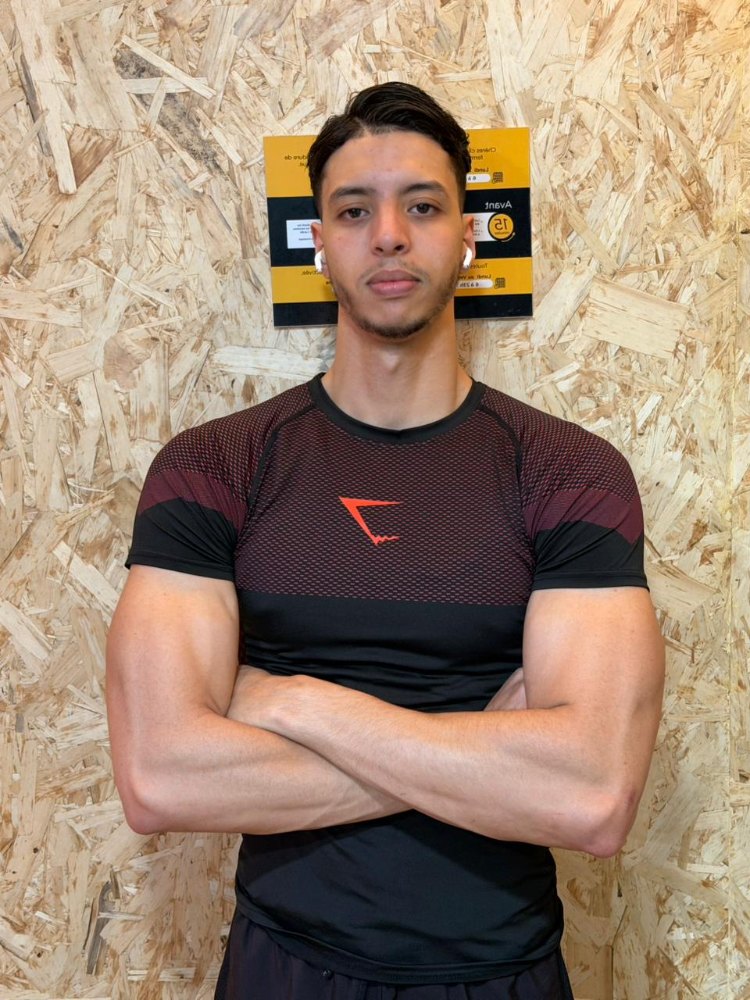 Younes Eddiki, fitness coach from Morocco teaching a live online cardio kickboxing class built on shadow boxing combinations for beginners