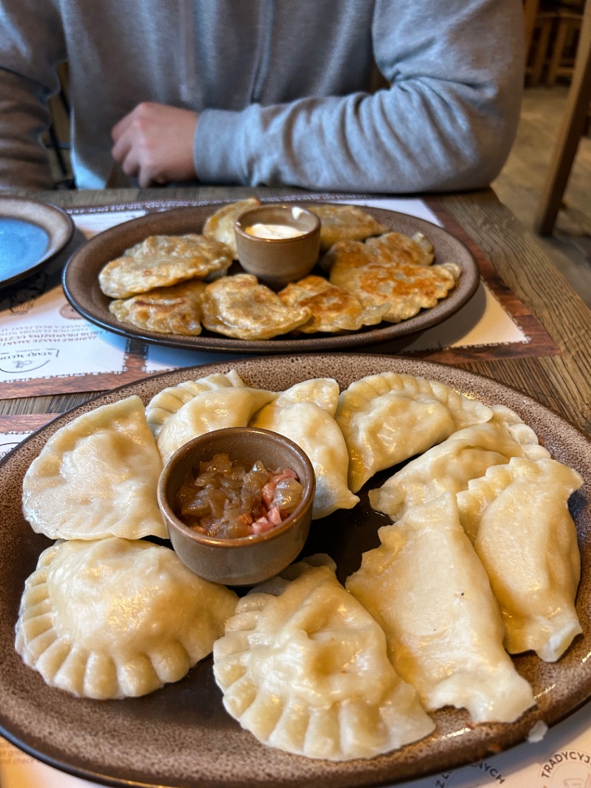 Authentic Polish pierogi with potato, mushroom and onion filling served with sour cream — from P2Bridge's live online pierogi class