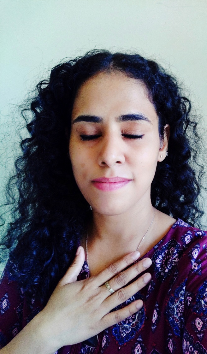 Shishira Saini, yoga instructor from India teaching a live online yoga for calm and balance class using mindful movement and breathwork for steadiness