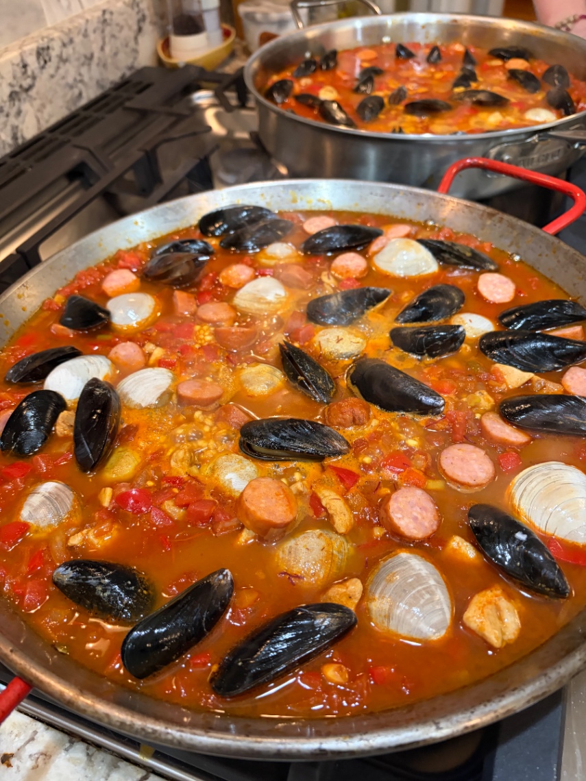 Finished paella served with citrus Manchego salad from chef Shawnie Kelley's online Spanish paella class